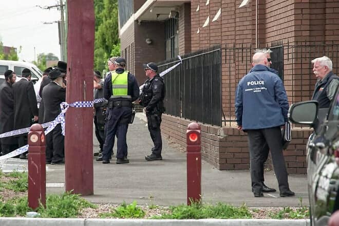 Police officers investigate near the scene of a fire at the Adass Israel Synagogue in Melbourne, on Dec. 6, 2024. Photo by Tania Lee/AFP via Getty Images.