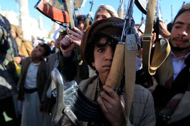 Supporters of Yemen's Huthi group raise up their arms during a rally in solidarity "with the people of Gaza" in the Huthi-controlled capital Sanaa on Dec. 13, 2024 amid the ongoing war in the Gaza Strip between Israel and Hamas. Photo by Mohammed Huwais/AFP via Getty Images.