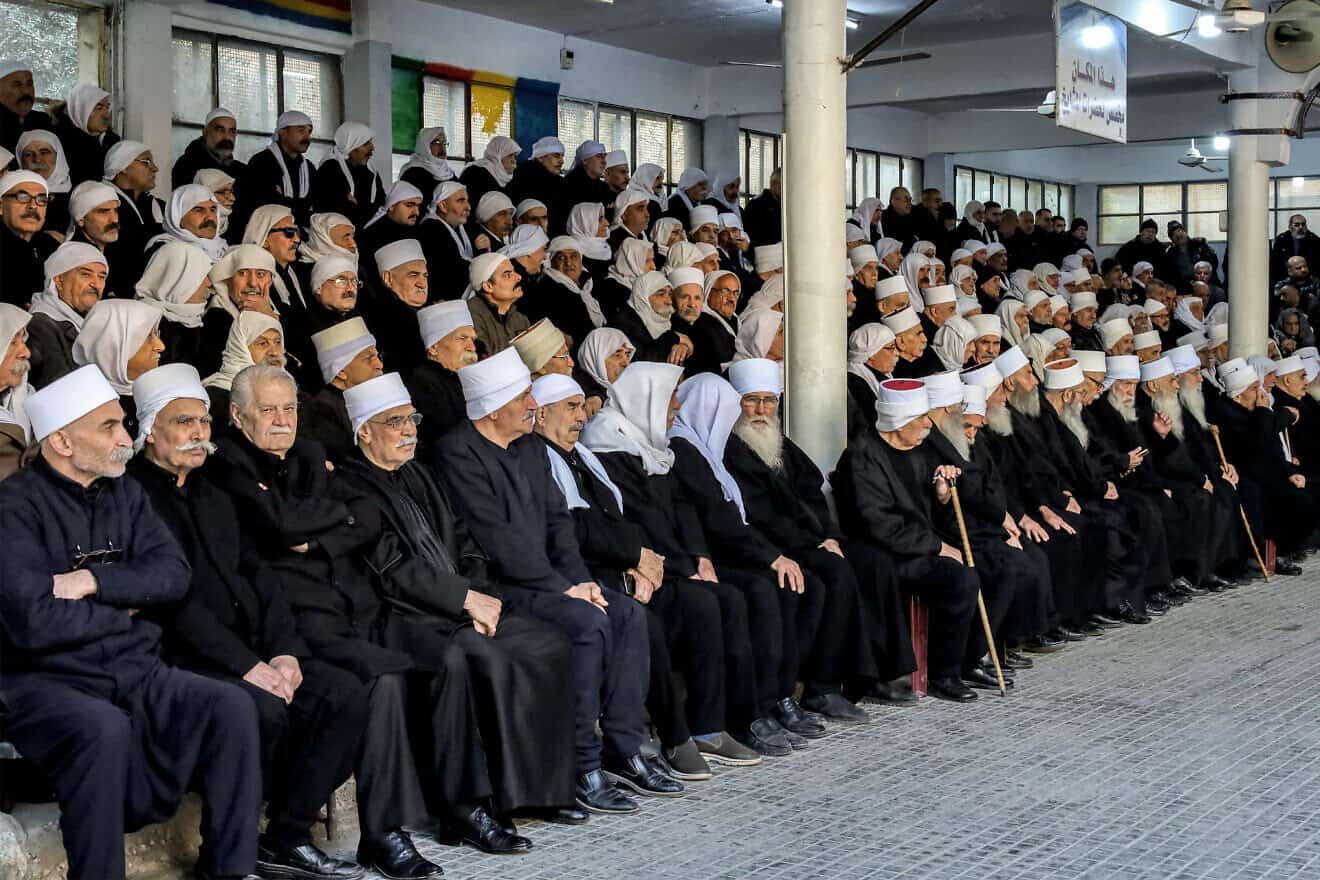 Members of Syria's Druze community attend a memorial service for 23 local Syrians who died in Saydnaya and other Assad-regime prisons in Jaramana in the Damascus countryside on the city's outskirts, on Dec. 21, 2024. Photo by Shadi al-Dubaisi/AFP via Getty Images.