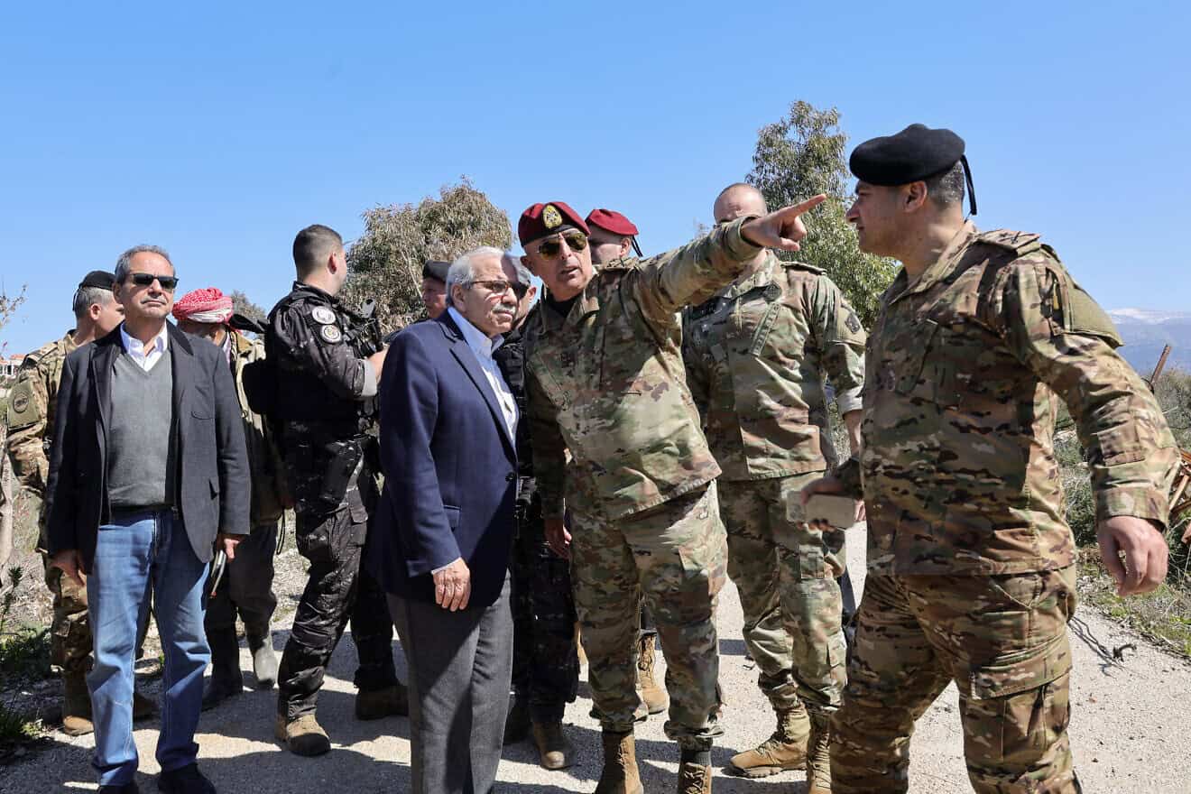 A Lebanese army officer shows Lebanon's Prime Minister Nawaf Salam an Israeli military position on the horizon, in the southern village of Khiam near the border with Israel, on Feb. 28, 2025. Photo by Rabih Daher/AFP via Getty Images.