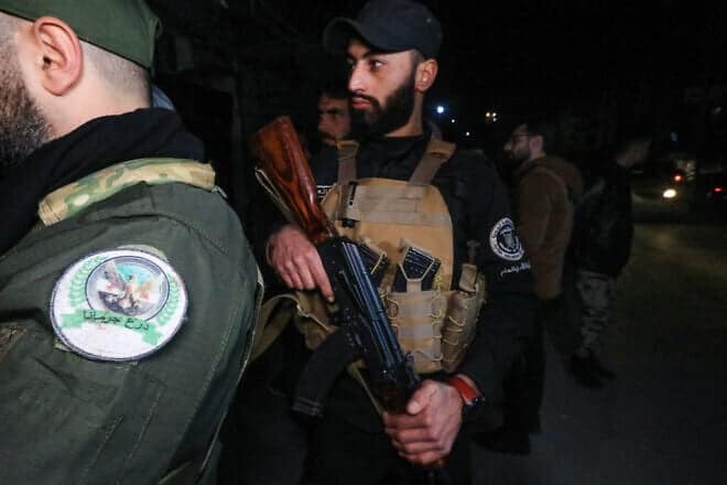 Members of Syria's new authorities security forces at a checkpoint as they deploy in the Druze and Christian majority Jaramana suburb of Damascus, on March 2, 2025. Photo by Bakr Alkasem/AFP via Getty Images.