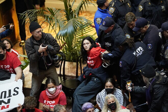 Jewish Voice for Peace protesters are detained by officers of the New York City Police Department inside Trump Tower in Midtown Manhattan on March 13, 2025. Photo by Timothy A. Clary/AFP via Getty Images.
