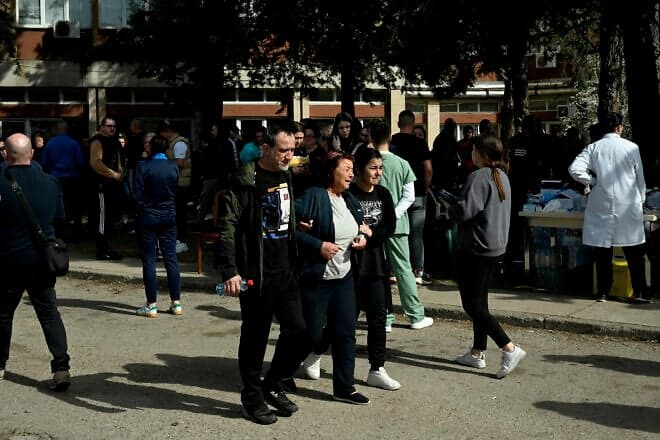 Friends and relatives of the victims gather in front of a hospital following a fire in a nightclub which killed 51 people in Kocani, a town some 100 kilometers east of the capital Skopje, on March 16, 2025. Photo: Robert Atanasovski/AFP via Getty Images.