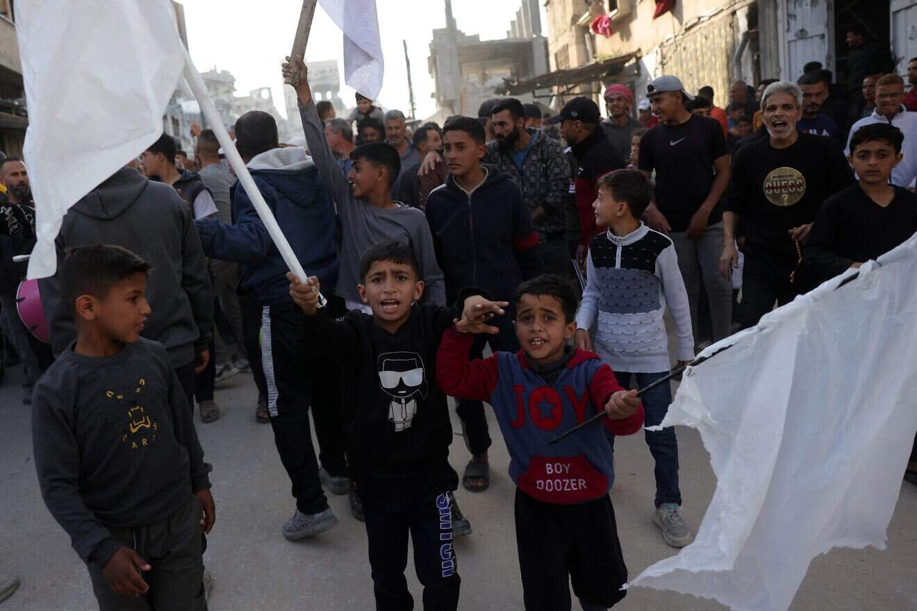 Palestinian children wave white flags during an anti-Hamas protest, calling for an end to the war with Israel, in Beit Lahia in the northern Gaza Strip on March 26, 2025. Photo by AFP via Getty Images.