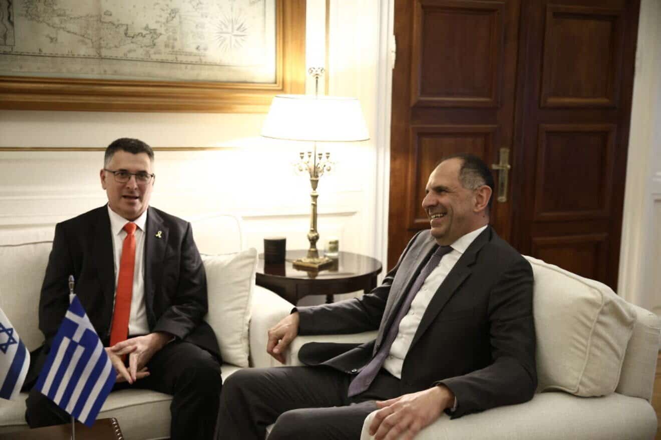 Greek Foreign Minister Giorgos Gerapetritis (right) welcomes Israeli Foreign Minister Gideon Sa'ar for the Trilateral Meeting of Greece, Cyprus and Israel in Athens, on March 13, 2025. Photo by Dimitris Kapantais/SOOC/AFP via Getty Images.