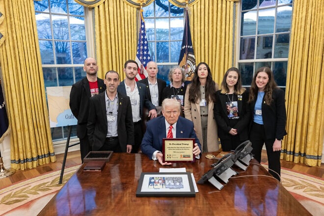 U.S. President Donald Trump meets with released hostages in the Oval Office at the White House on March 5, 2025. Credit: Molly Riley/White House.