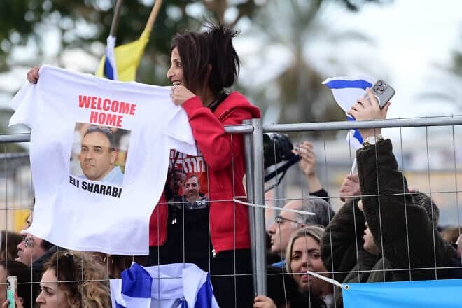 Israelis wait for the arrival of released hostages Or Levy and Eli Sharabi at the Sheba Medical center in Ramat Gan, Feb. 8, 2025. Photo by Tomer Neuberg/Flash90.