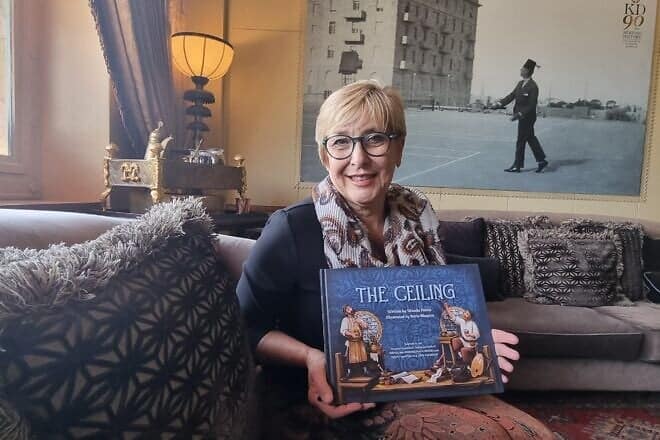Wanda Peretz with a copy of her book at the King David Hotel in Jerusalem. Photo by Sharon Altshul.