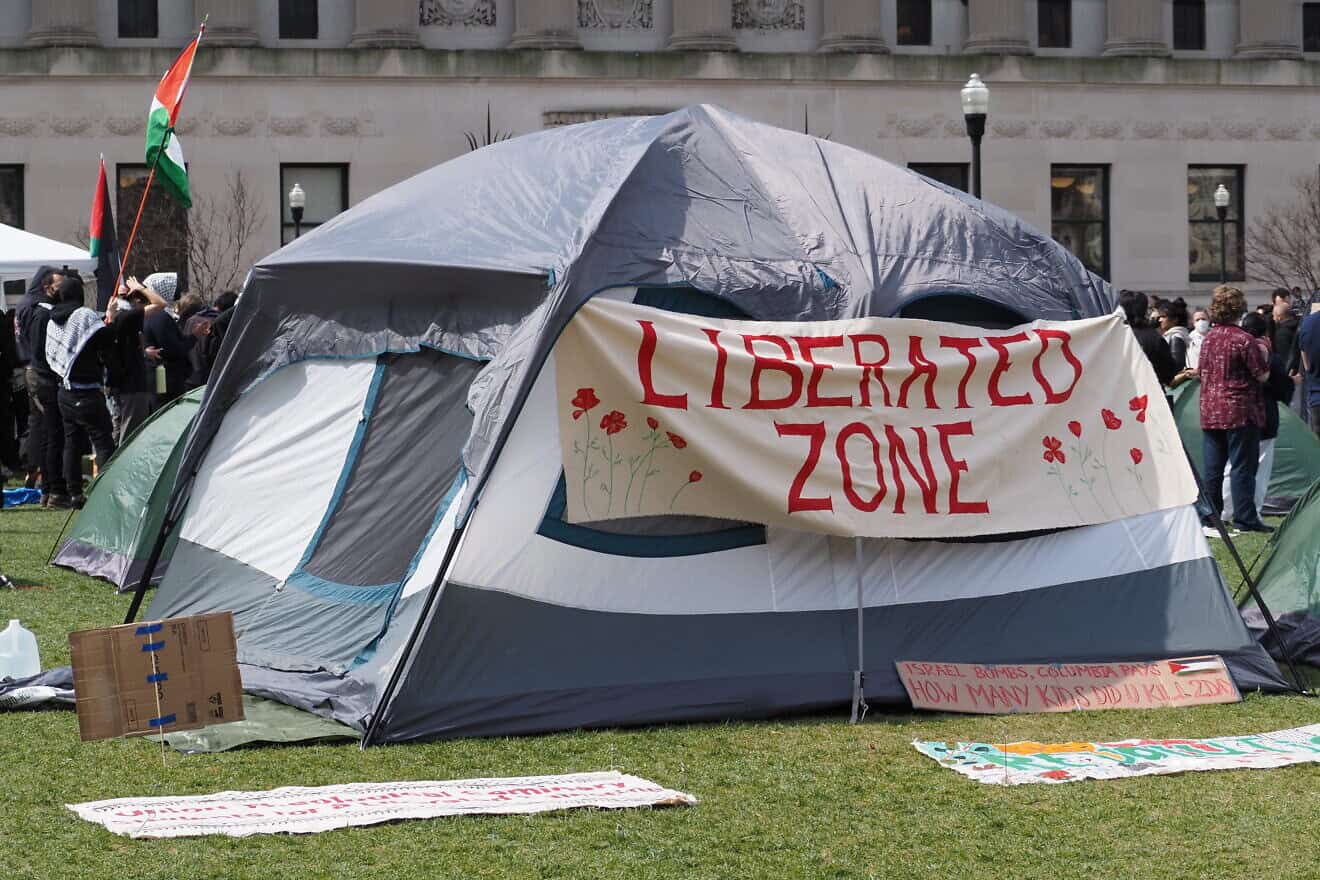 A tent displays a banner saying "Liberated Zone" as protesters occupy Columbia University's east lawn. April 17, 2024. Credit: Wm3214 via Wikimedia Commons.