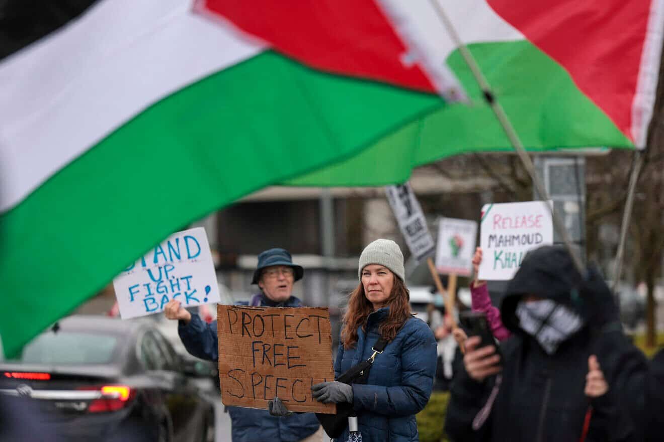 People hold signs as they protest the arrest of former Columbia University student activist Mahmoud Khalil and show support for Palestinians during a “Fight for Our Rights” demonstration by Shut It Down for Palestine (SID4P) and various local groups at the University of Washington campus in Seattle on March 15, 2025. Photo by Jason Redmond/AFP via Getty Images.