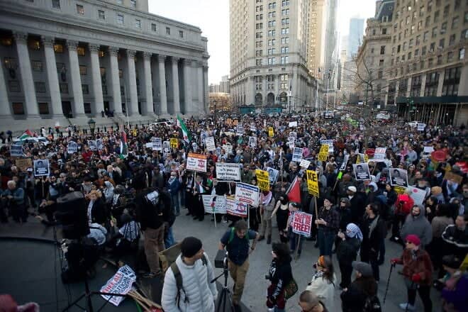 A protest in Thomas Paine Park in Lower Manhattan's Foley Square, also called Federal Plaza, against the detention of Palestinian activist and Columbia University student Mahmoud Khalil, March 10, 2025. Credit: SWinxy via Wikimedia Commons.