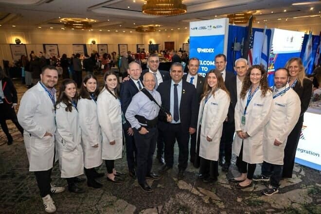 Israeli Aliyah and Integration Minister Ofir Sofer and Nefesh B'Nefesh founders Rabbi Yehoshua Fass and Tony Gelbart pose with doctors at the MedEx conference in New Jersey on March 9, 2025. Photo by Shahar Azran.