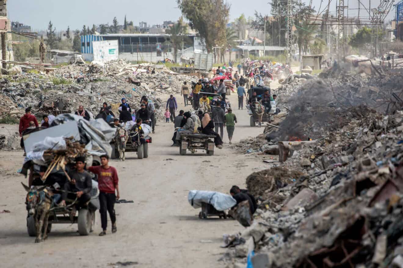 Palestinians leave Beit Hanun in the northern Gaza Strip, heading toward Gaza City following Israeli evacuation orders, on March 19, 2025. Photo by Bashar Taleb/AFP via Getty Images.