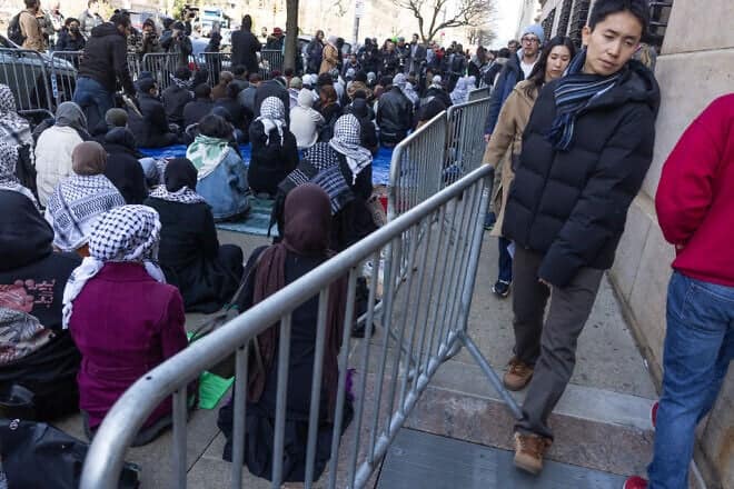 Pro-Palestinian activists hold a Friday prayer service and demonstration outside the gates of Columbia University in Manhattan on March 14, 2025. Photo by Andrew Lichtenstein/Corbis via Getty Images.