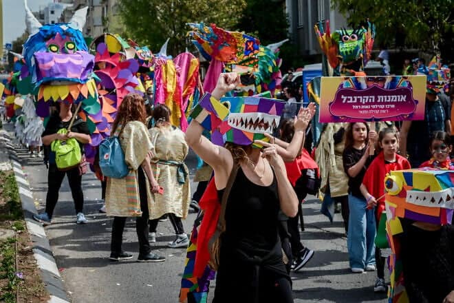 Israelis enjoy the Purim parade in the city of Holon, south of Tel Aviv, March 7, 2023. Photo by Avshalom Sassoni/Flash90.