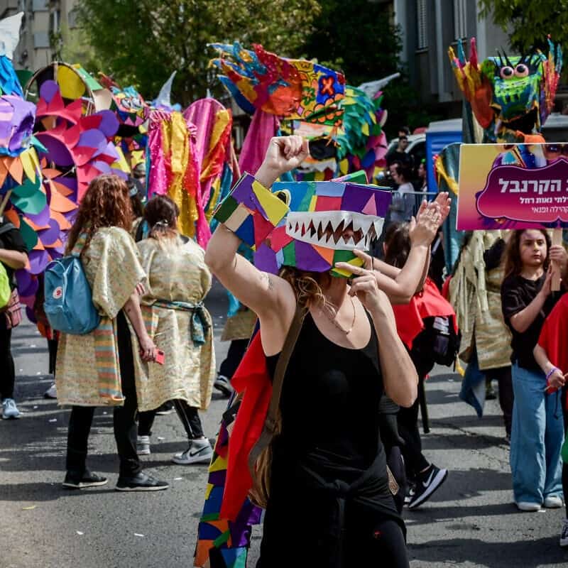 Israelis enjoy the Purim parade in the city of Holon, south of Tel Aviv, March 7, 2023. Photo by Avshalom Sassoni/Flash90.
