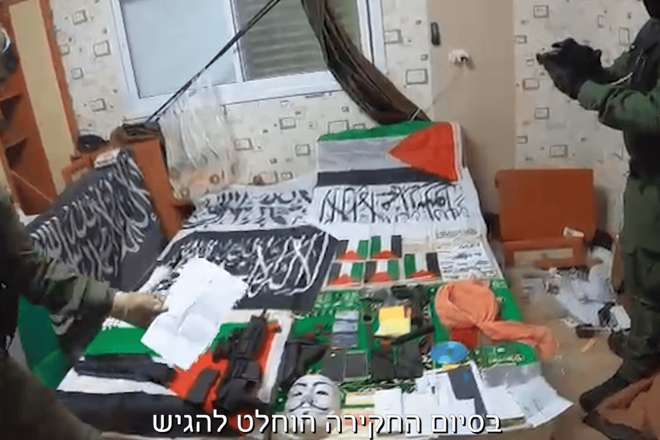 A screenshot from an Israel Police video from the arrest of an Israeli Arab suspected of swearing allegiance to ISIS and assisting Palestinian terror groups, Tayibe, Israel, March 12, 2025. Credit: Israel Police.