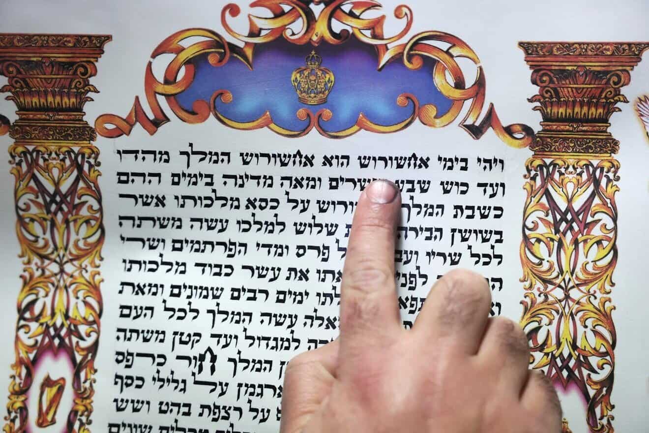 A “sofer” (Hebrew for “scribe”) writes the scroll of Esther for the Jewish holiday of Purim in the northern Israeli city of Safed on March 5, 2025. Photo by David Cohen/Flash90.