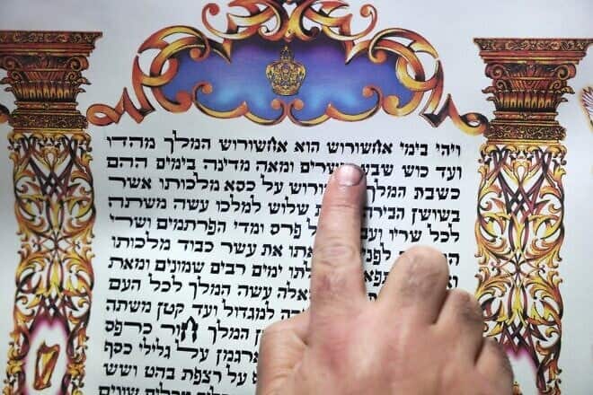 A “sofer” (Hebrew for “scribe”) writes the scroll of Esther for the Jewish holiday of Purim in the northern Israeli city of Safed on March 5, 2025. Photo by David Cohen/Flash90.