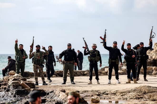 Members of security forces loyal to the interim Syrian government on the Mediterranean coast in Latakia, on March 9, 2025. Photo by Omar Haj Kadour/AFP via Getty Images.