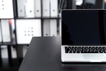 Laptop in office setting. Credit: Umer Idrisi via Pixabay.