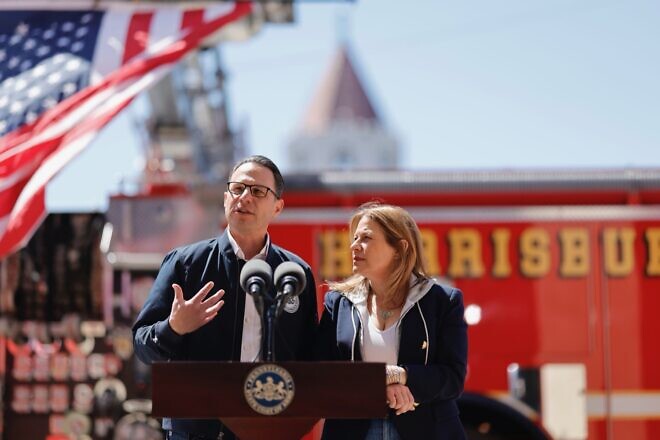 Pennsylvania Gov. Josh Shapiro and his wife Lori Shapiro speak to reporters outside a Harrisburg fire station after serving lunch to thank firefighters who responded to the arson attack at the governor's mansion, April 17, 2025. Credit: Commonwealth Media Services.