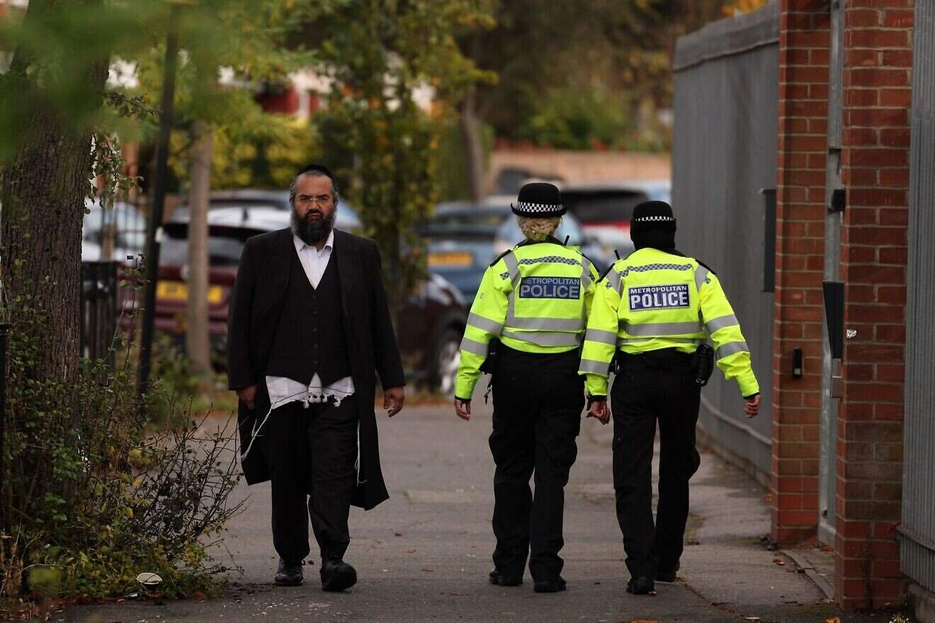Metropolitan police officers are seen patrolling the ultra-Orthodox Jewish communities in Stamford Hill, north London on Oct. 13, 2023. Photo by Daniel Leal/AFP via Getty Images.