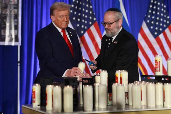 Then-Republican presidential nominee President Donald Trump and Rabbi Yehuda Kaploun light a candle during an Oct. 7 remembrance event at the Trump National Doral Golf Club in Doral, Florida, on Oct. 07, 2024. Photo by Joe Raedle/Getty Images.