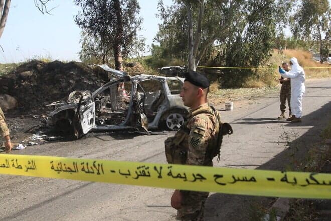Lebanese security forces and forensic experts inspect the scene of an Israeli airstrike in Baawerta (Baaouerta), near the coastal town of Damour, about 20 kilometres south of Beirut, which reportedly killed a terrorist leader of Jamaa Islamiya, a Lebanese Islamist group allied with Palestinian Hamas, on April 22, 2025. Photo by Mahmoud Zayyat/AFP via Getty Images.
