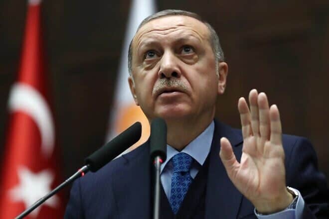Turkish President and leader of the Justice and Development Party (AK Party) Recep Tayyip Erdogan gestures as he delivers a speech during the AKP's parliamentary group meeting at the Grand National Assembly of Turkey (TBMM) in Ankara, on April 24, 2018. Photo by Adem Altan/AFP via Getty Images.