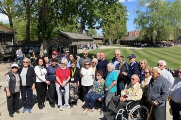 Holocaust survivors at Auschwitz, 80 years after it was liberated, with Merrill Eisenhower, the great-grandson of U.S. Gen. Dwight D. Eisenhower, on April 23, 2025. Photo by Etgar Lefkovits.
 