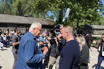 Holocaust survivor Naftali Furst speaks with Merrill Eisenhower, the great-grandson of U.S. Gen. Dwight D. Eisenhower, on April 23, 2025. Photo by Etgar Lefkovits.