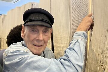 George Shefi reviews the Book of Names at Auschwitz, April 23, 2025. Photo by Etgar Lefkovits.