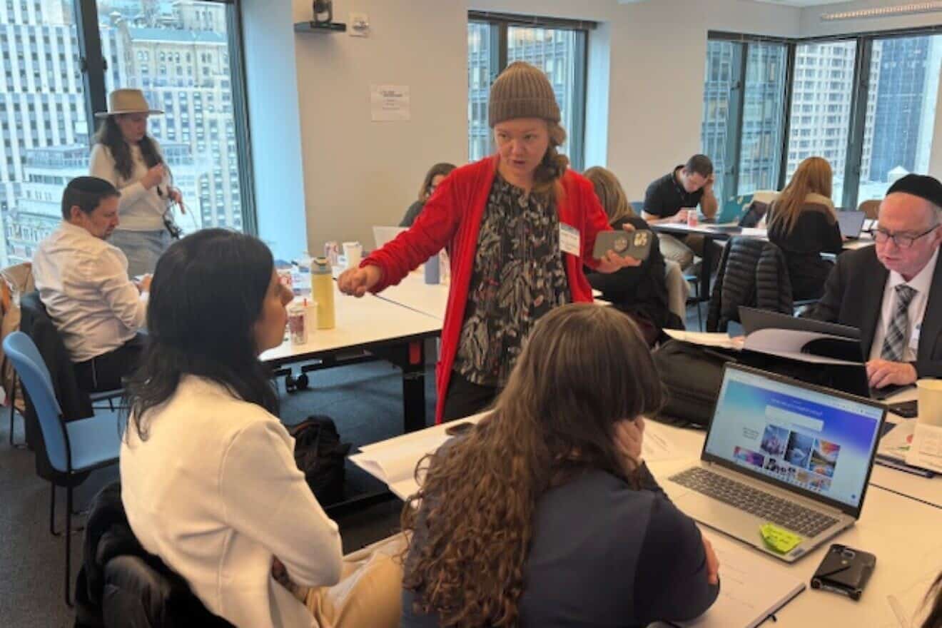 The Jewish Education Project's Rivkah Schack guides participants through the application of AI tools for the teaching of general studies. Photo by Gary Pretsfelder.