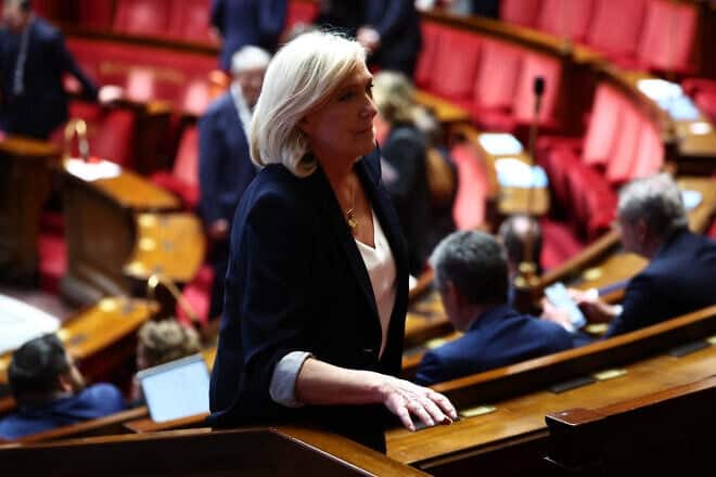 Marine Le Pen, president of Rassemblement National parliamentary group, arrives at a session of questions to the government at the National Assembly, France's lower house parliament, in Paris on April 1, 2025. Photo by Anne-Christine Poujoulat/AFP via Getty Images.