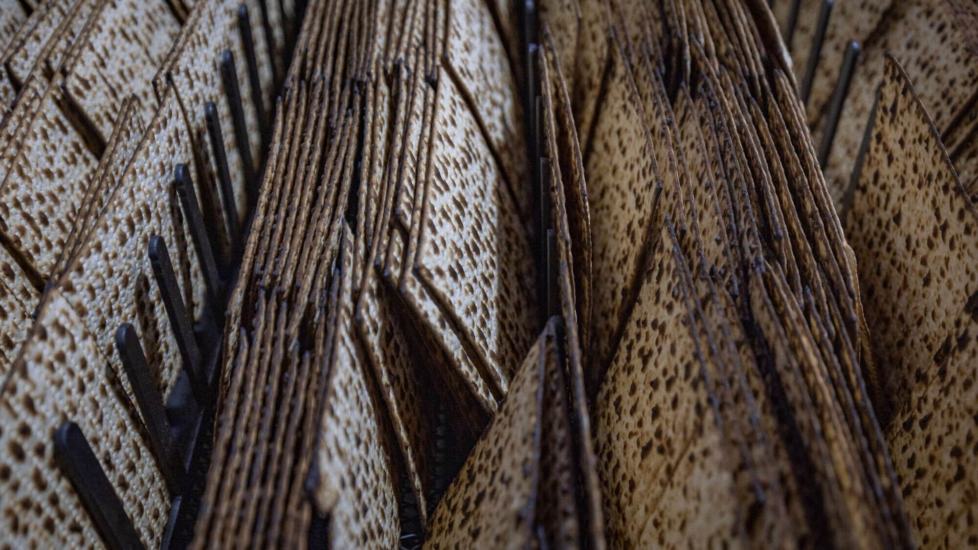 Workers prepare matzah, traditional unleavened bread eaten during the eight-day Jewish holiday of Passover, in "Yehuda Matzos" plant in Jerusalem, April 3, 2025. Photo by Yonatan Sindel/Flash90.