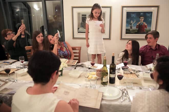 A family at the Passover seder on the first night of the holiday in Tzur Hadassah, Israel, April 22, 2016. Photo By Nati Shohat/Flash90.